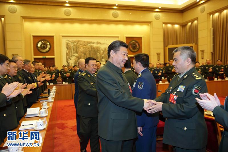 2016年3月13日，習近平出席十二屆全國人大四次會議解放軍代表團全體會議並發表重要講話。這是習近平同軍隊人大代表親切握手。記者李剛攝