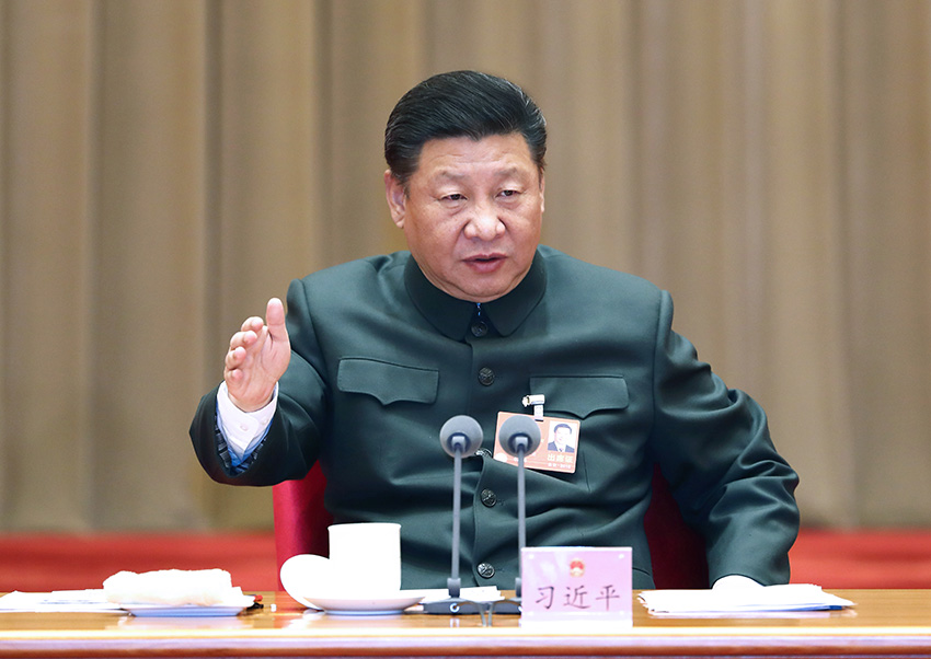 2018年3月12日上午，中共中央總書記、國家主席、中央軍委主席習(xí)近平出席十三屆全國人大一次會(huì)議解放軍和武警部隊(duì)代表團(tuán)全體會(huì)議並發(fā)表重要講話。新華社記者 李剛 攝